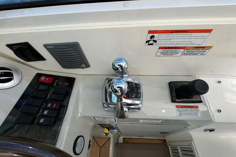 The Office Yacht Photos Pics Control panel of 2011 Sea Ray 470 Sundancer with throttle and joystick controls.