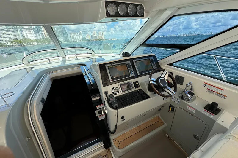 The Office Yacht Photos Pics Cockpit of 2011 Sea Ray 470 Sundancer yacht with navigation controls and ocean view.