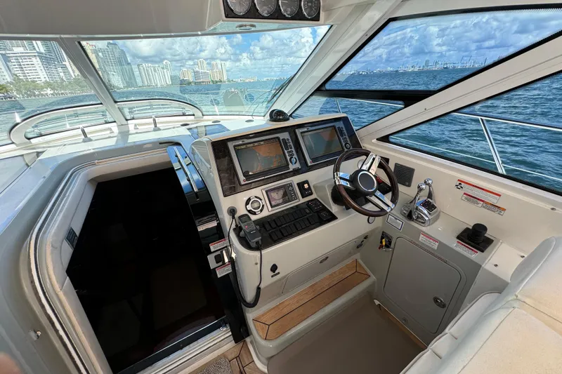 The Office Yacht Photos Pics Interior helm of 2011 Sea Ray 470 Sundancer yacht with navigation controls and ocean view.