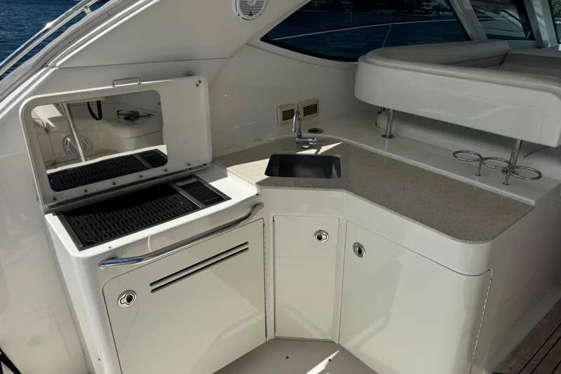 The Office Yacht Photos Pics Luxurious 2011 Sea Ray 470 Sundancer yacht kitchenette with grill and sink.