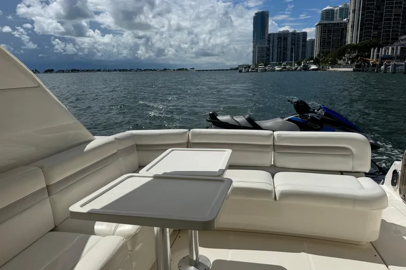 The Office Yacht Photos Pics Luxurious 2011 Sea Ray 470 Sundancer yacht interior with waterfront cityscape view.