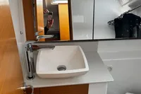 Modern bathroom sink and faucet in 2022 Dufour 32 yacht interior.