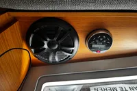 Speaker and control panel inside 2022 Dufour 32 yacht cabin.
