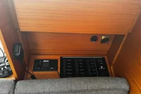 Control panel of 2022 Dufour 32 yacht with B&G equipment and wooden finish.