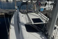2022 Dufour 32 sailboat docked at marina, showcasing sleek deck design and rigging.