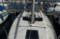 2022 Dufour 32 sailboat docked at marina, showcasing deck and rigging.