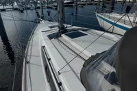 2022 Dufour 32 sailboat deck view in marina setting.