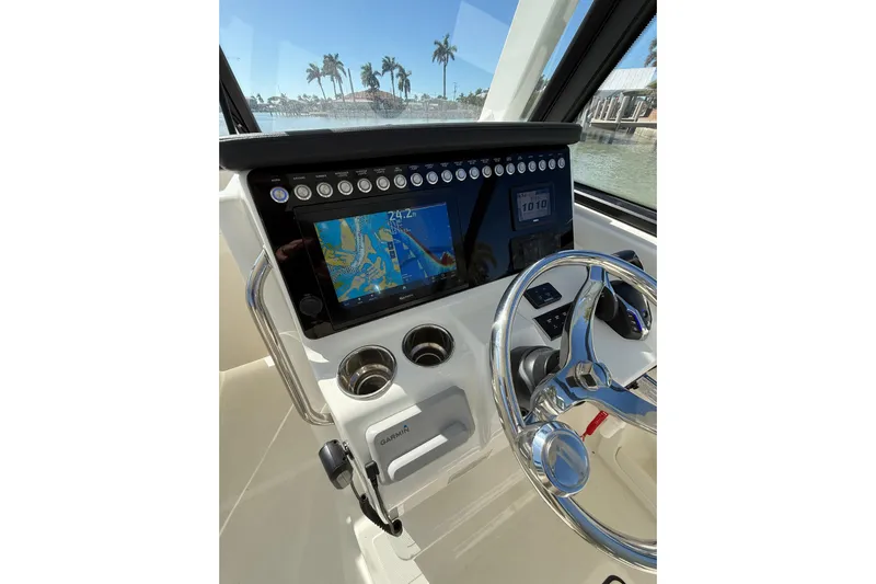  Yacht Photos Pics Helm of 2025 World Cat 260 DC-X with navigation display and steering wheel.