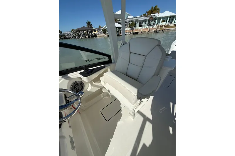  Yacht Photos Pics 2025 World Cat 260 DC-X boat interior with plush seating and steering wheel.