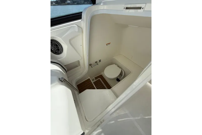  Yacht Photos Pics 2025 World Cat 260 DC-X boat interior with compact marine toilet.