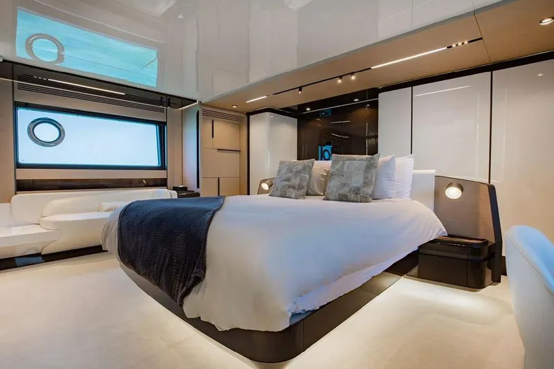 Lance West Yacht Photos Pics Luxurious bedroom interior of 2022 Azimut S10 yacht with modern design and elegant furnishings.