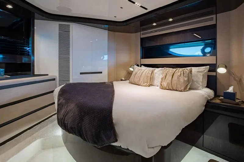 Lance West Yacht Photos Pics Luxurious bedroom interior of 2022 Azimut S10 yacht with modern design and cozy bedding.