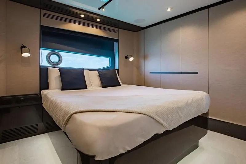 Lance West Yacht Photos Pics Luxurious bedroom interior of 2022 Azimut S10 yacht with modern design and cozy bedding.