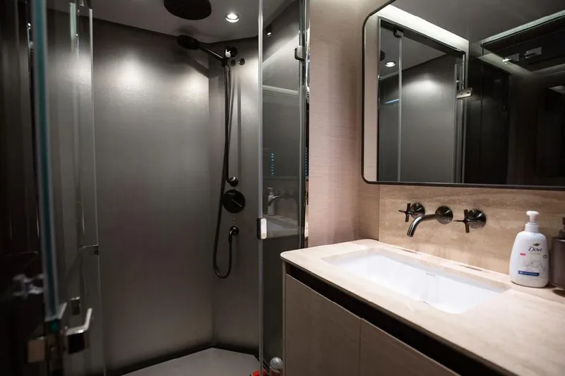 Lance West Yacht Photos Pics Luxurious bathroom in 2022 Azimut S10 yacht with modern shower and sleek vanity.