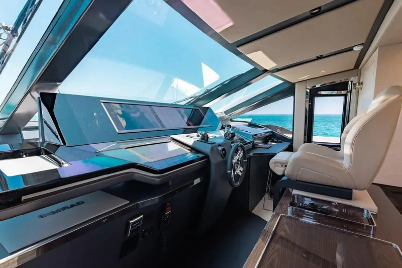 Lance West Yacht Photos Pics Luxurious 2022 Azimut S10 yacht cockpit with modern controls and panoramic ocean view.