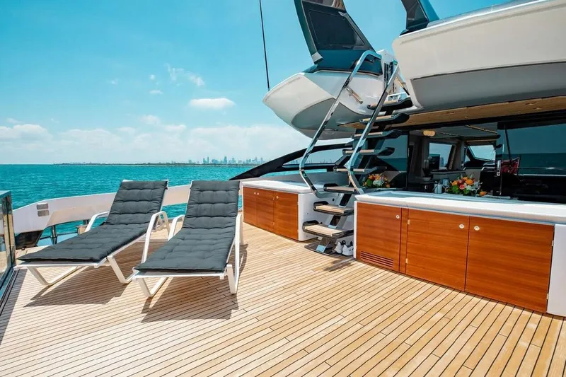 Lance West Yacht Photos Pics Luxurious 2022 Azimut S10 yacht deck with sun loungers and ocean view.