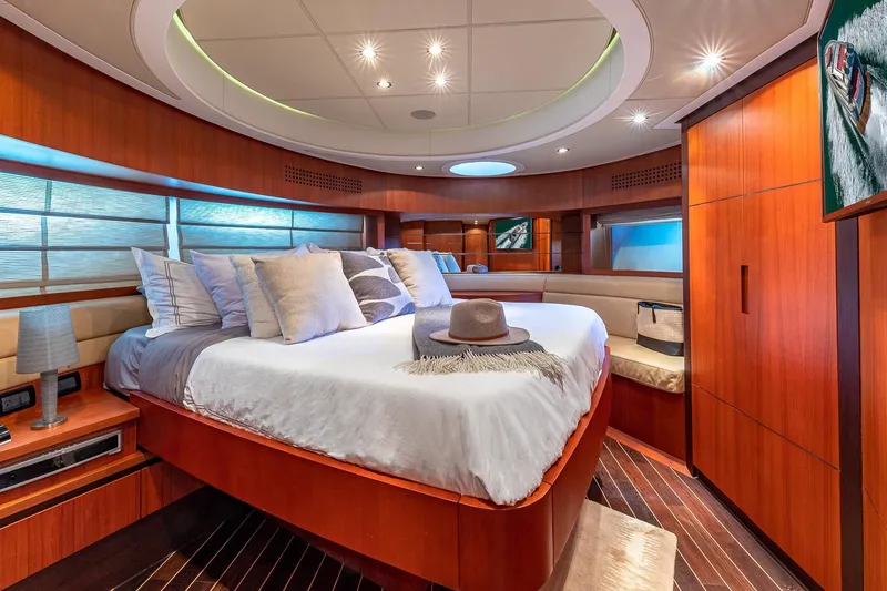 Regal Yacht Photos Pics Luxurious 2008 Pershing 90 yacht bedroom with elegant wood finishes and modern decor.