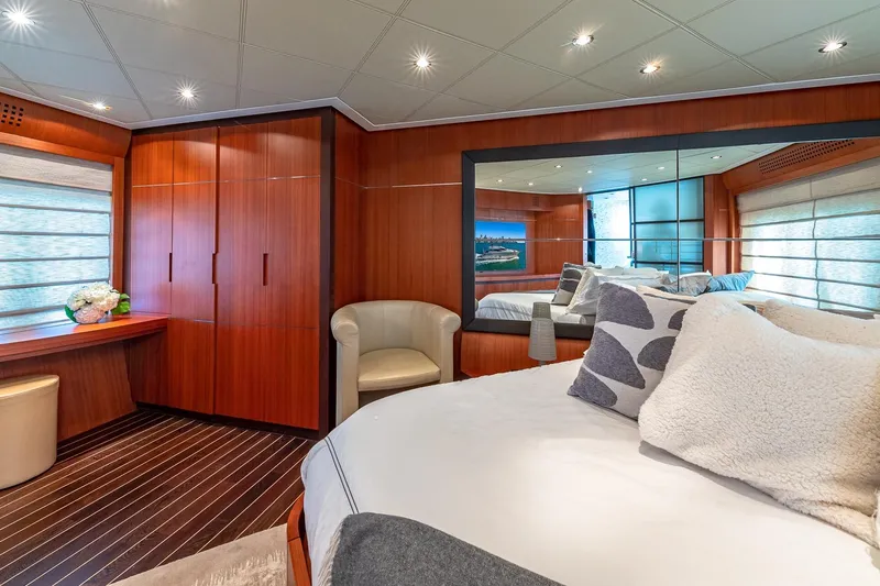 Regal Yacht Photos Pics Luxurious 2008 Pershing 90 yacht bedroom with elegant wood paneling and modern decor.