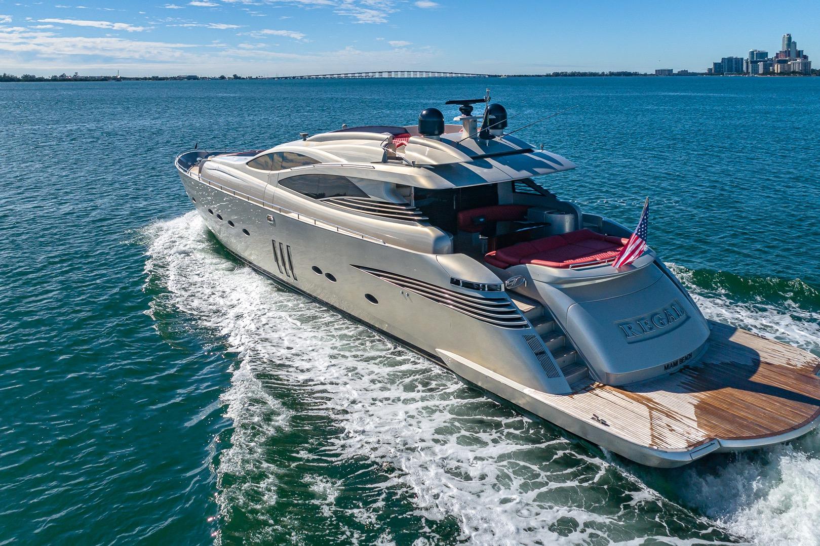 Luxurious 2008 Pershing 90 yacht cruising on open water, featuring sleek design and American flag.