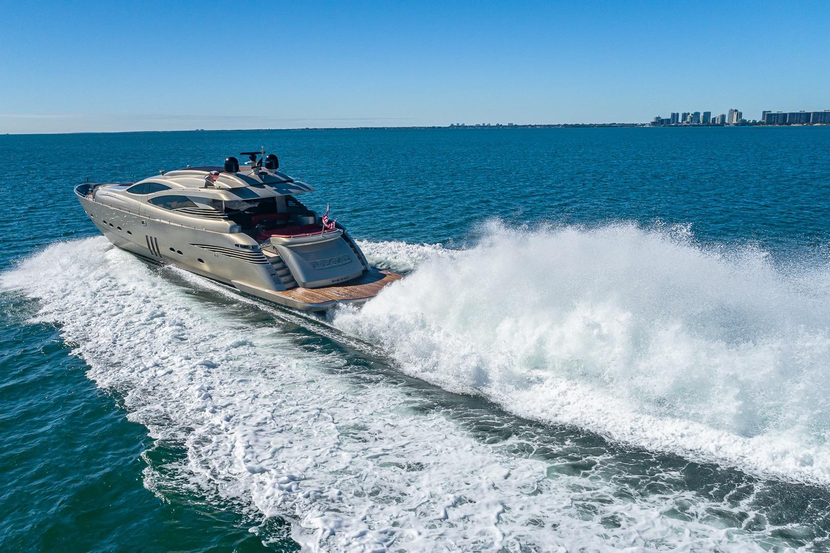 Luxurious 2008 Pershing 90 yacht cruising swiftly on open blue waters.