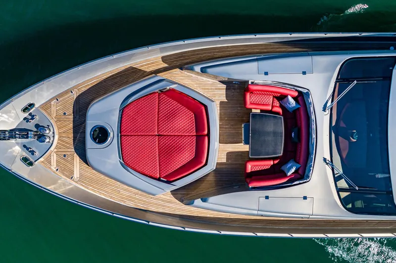 Regal Yacht Photos Pics Aerial view of 2008 Pershing 90 yacht with red seating and wooden deck.