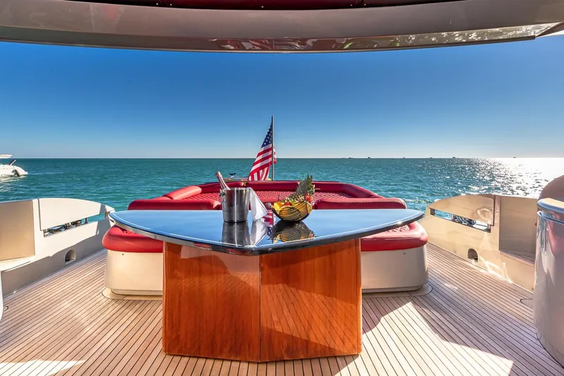 Regal Yacht Photos Pics Luxurious 2008 Pershing 90 yacht deck with ocean view and American flag.