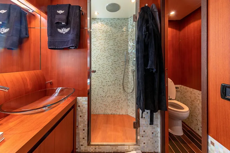 Regal Yacht Photos Pics Luxurious bathroom on 2008 Pershing 90 yacht with glass sink and modern shower.