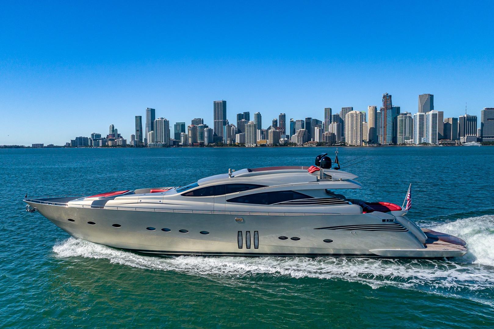 2008 Pershing 90 yacht cruising near city skyline on a sunny day.