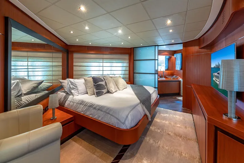 Regal Yacht Photos Pics Luxurious bedroom interior of 2008 Pershing 90 yacht with modern design and elegant furnishings.