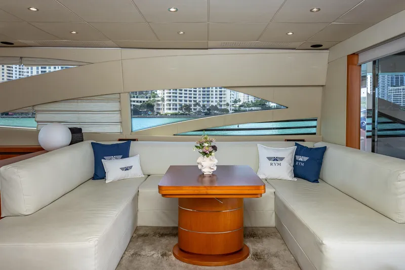 Regal Yacht Photos Pics Luxurious interior of a 2008 Pershing 90 yacht with elegant seating and decorative pillows.