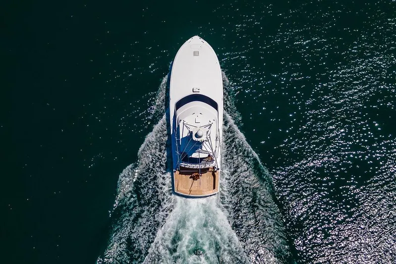 Sashimi Yacht Photos Pics Aerial view of 2014 Hatteras 63 GT yacht cruising on open water.
