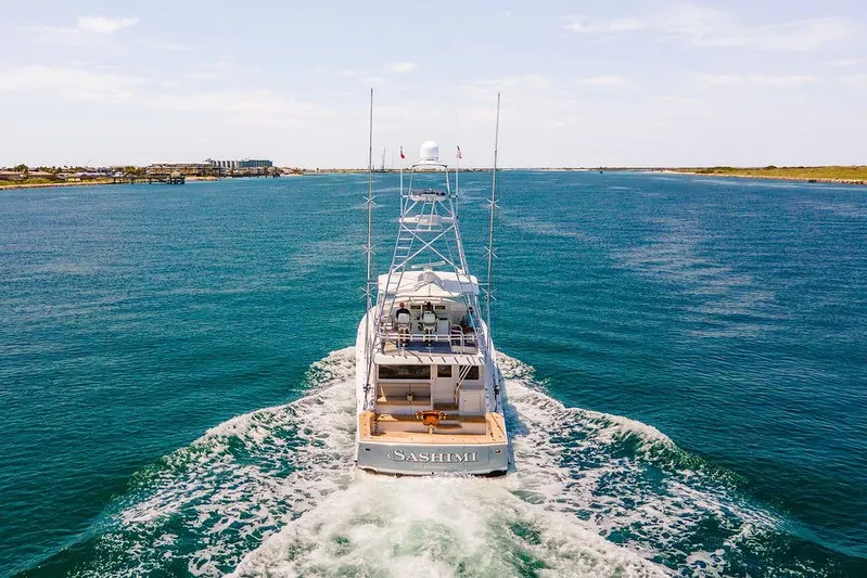 Sashimi Yacht Photos Pics 2014 Hatteras 63 GT yacht cruising on open water.