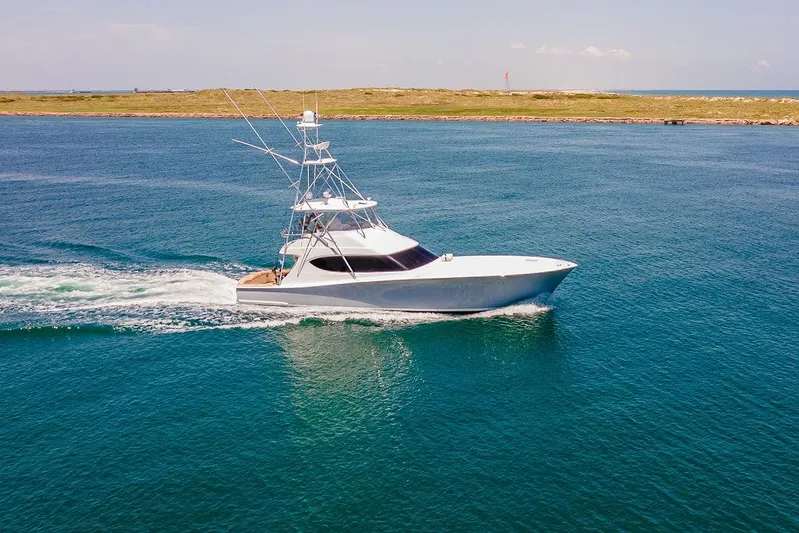 Sashimi Yacht Photos Pics 2014 Hatteras 63 GT yacht cruising on open water.