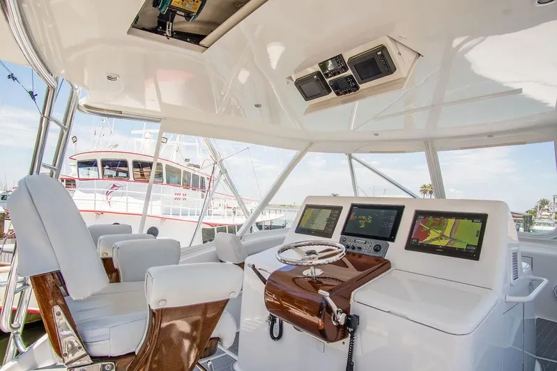 Sashimi Yacht Photos Pics Interior helm of 2014 Hatteras 63 GT yacht with modern navigation equipment.