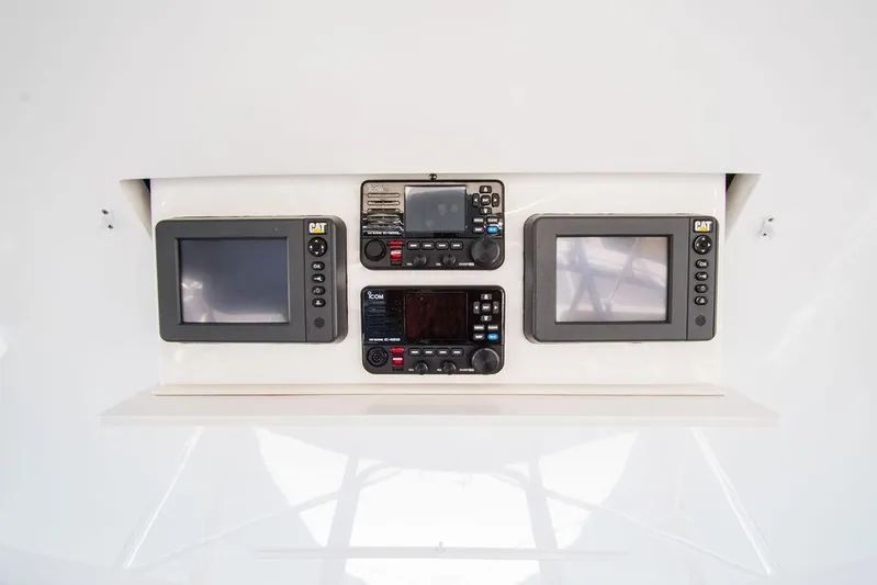 Sashimi Yacht Photos Pics Hatteras 63 GT 2014 dashboard with navigation and control screens.