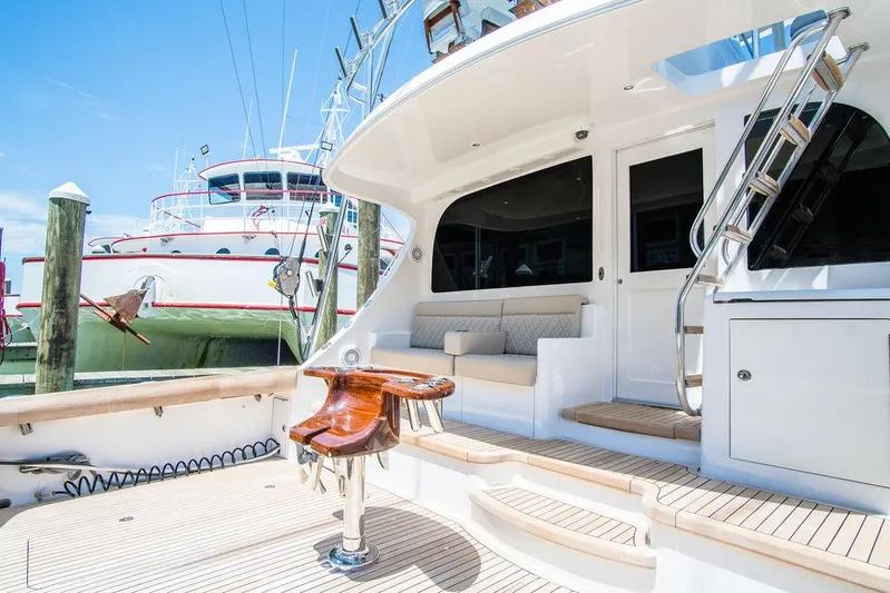 Sashimi Yacht Photos Pics 2014 Hatteras 63 GT yacht deck with seating and fishing chair.