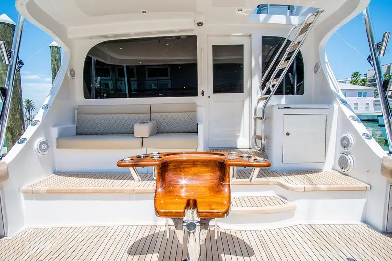 Sashimi Yacht Photos Pics Luxurious 2014 Hatteras 63 GT yacht deck with seating and polished wood accents.