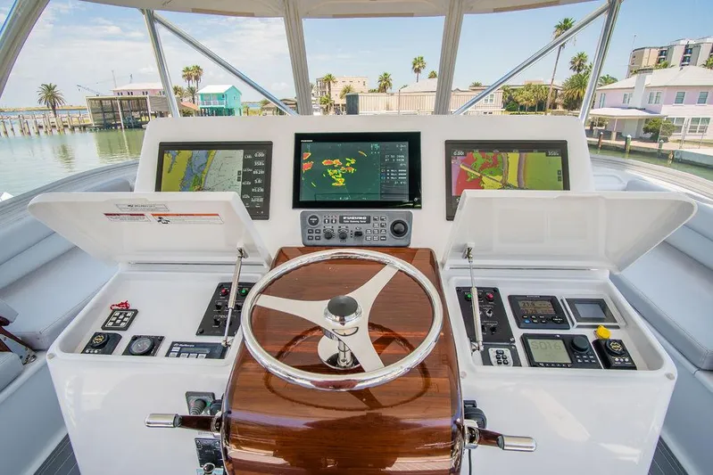 Sashimi Yacht Photos Pics Helm of 2014 Hatteras 63 GT yacht with advanced navigation displays and controls.
