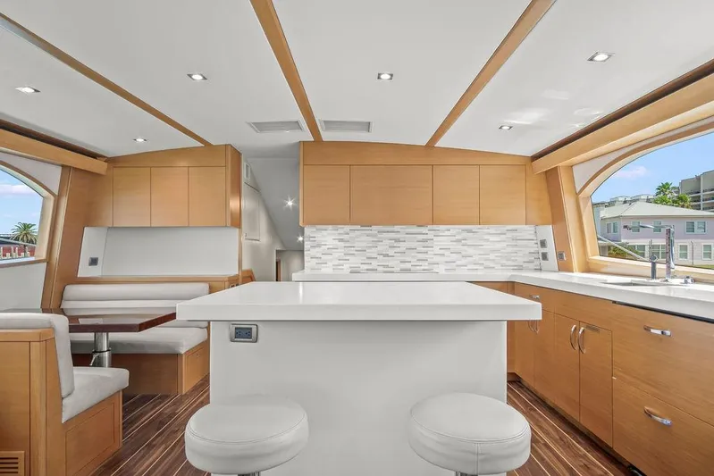 Sashimi Yacht Photos Pics Luxurious interior of 2014 Hatteras 63 GT yacht with modern kitchen and seating area.