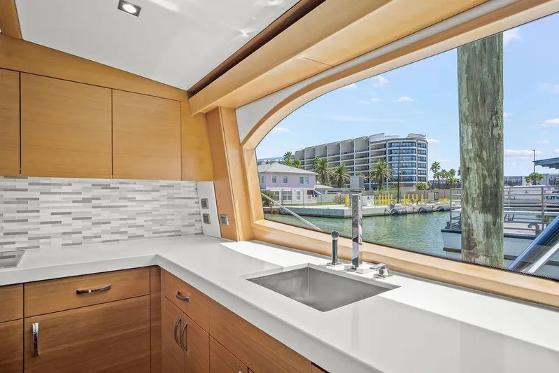 Sashimi Yacht Photos Pics Luxurious kitchen interior of 2014 Hatteras 63 GT yacht with waterfront view.