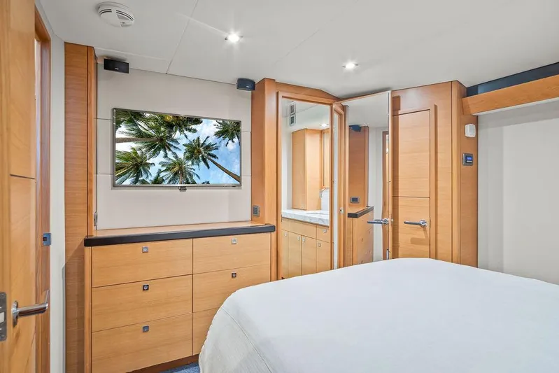 Sashimi Yacht Photos Pics Luxurious bedroom interior of 2014 Hatteras 63 GT yacht with modern wood finishes.