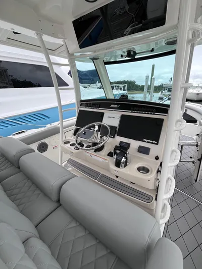  Yacht Photos Pics 2018 Boston Whaler 350 Outrage helm with modern controls and comfortable seating.