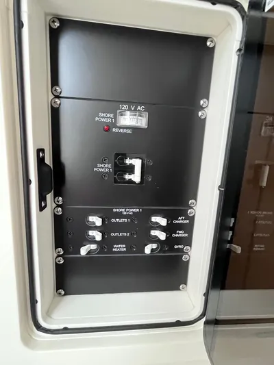  Yacht Photos Pics Electrical panel on a 2018 Boston Whaler 350 Outrage boat, featuring various switches and controls.