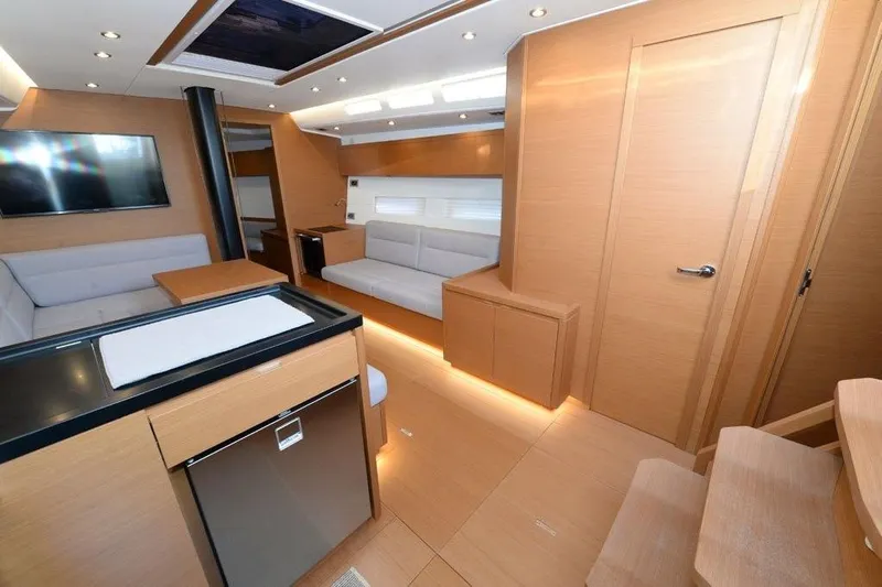 Yacht Photos Pics Luxurious interior of 2019 Grand Soleil 48 Performance yacht with modern furnishings.