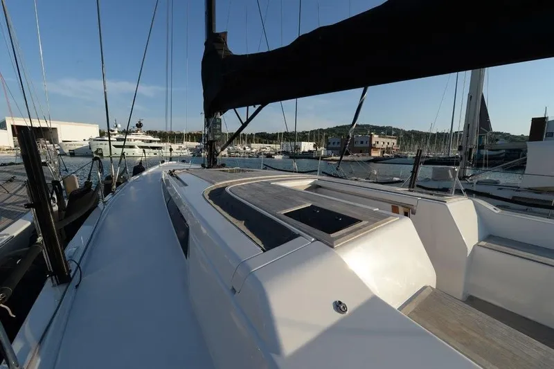  Yacht Photos Pics 2019 Grand Soleil 48 Performance yacht docked in a marina, showcasing sleek design and spacious deck.