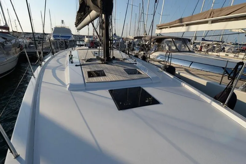  Yacht Photos Pics 2019 Grand Soleil 48 Performance yacht docked in a marina, showcasing sleek deck design.