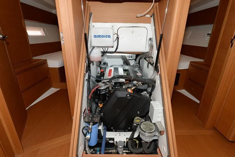 Yacht Photos Pics Engine room of 2019 Grand Soleil 48 Performance yacht, showcasing mechanical components.