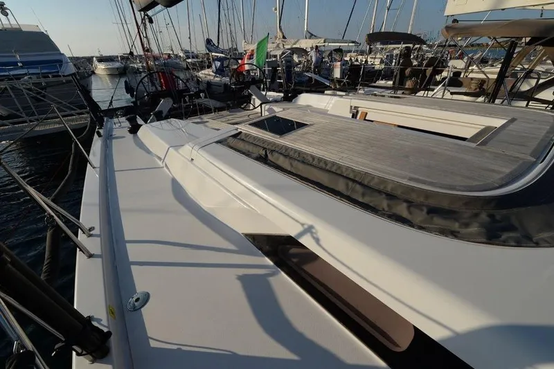  Yacht Photos Pics 2019 Grand Soleil 48 Performance yacht docked in a marina, showcasing sleek deck design.