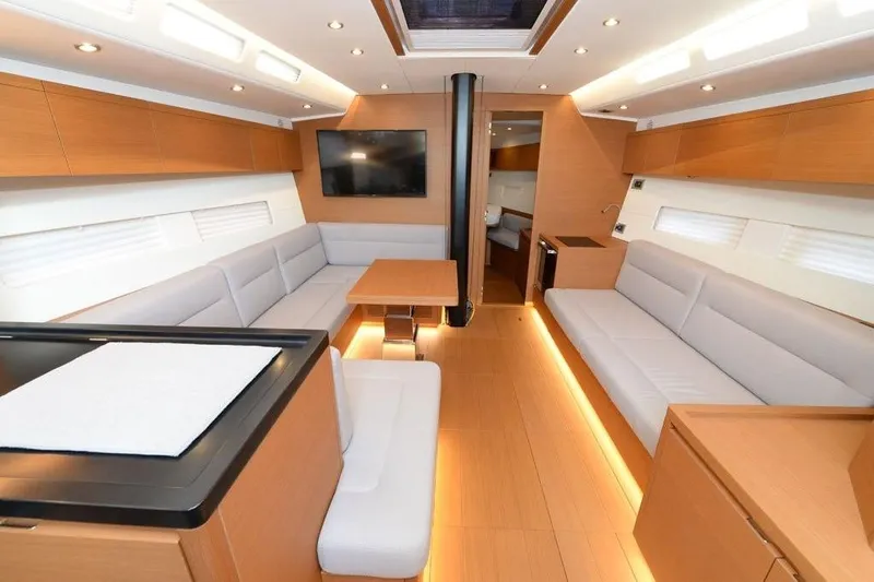  Yacht Photos Pics Luxurious interior of 2019 Grand Soleil 48 Performance yacht with modern furnishings.