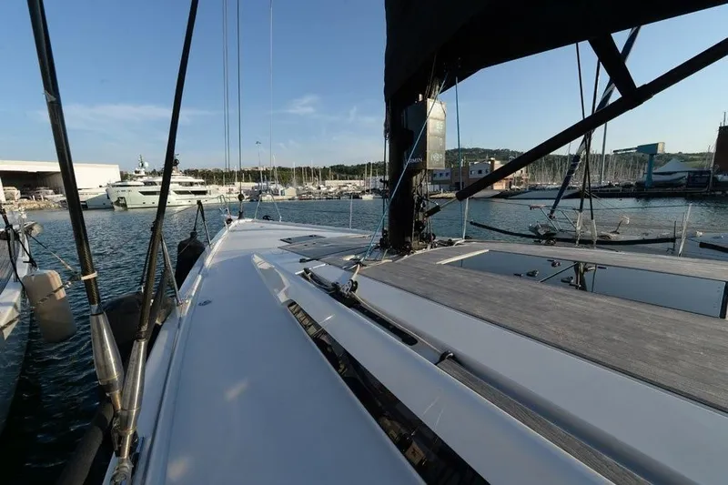  Yacht Photos Pics 2019 Grand Soleil 48 Performance yacht docked in a marina, showcasing sleek design and modern features.